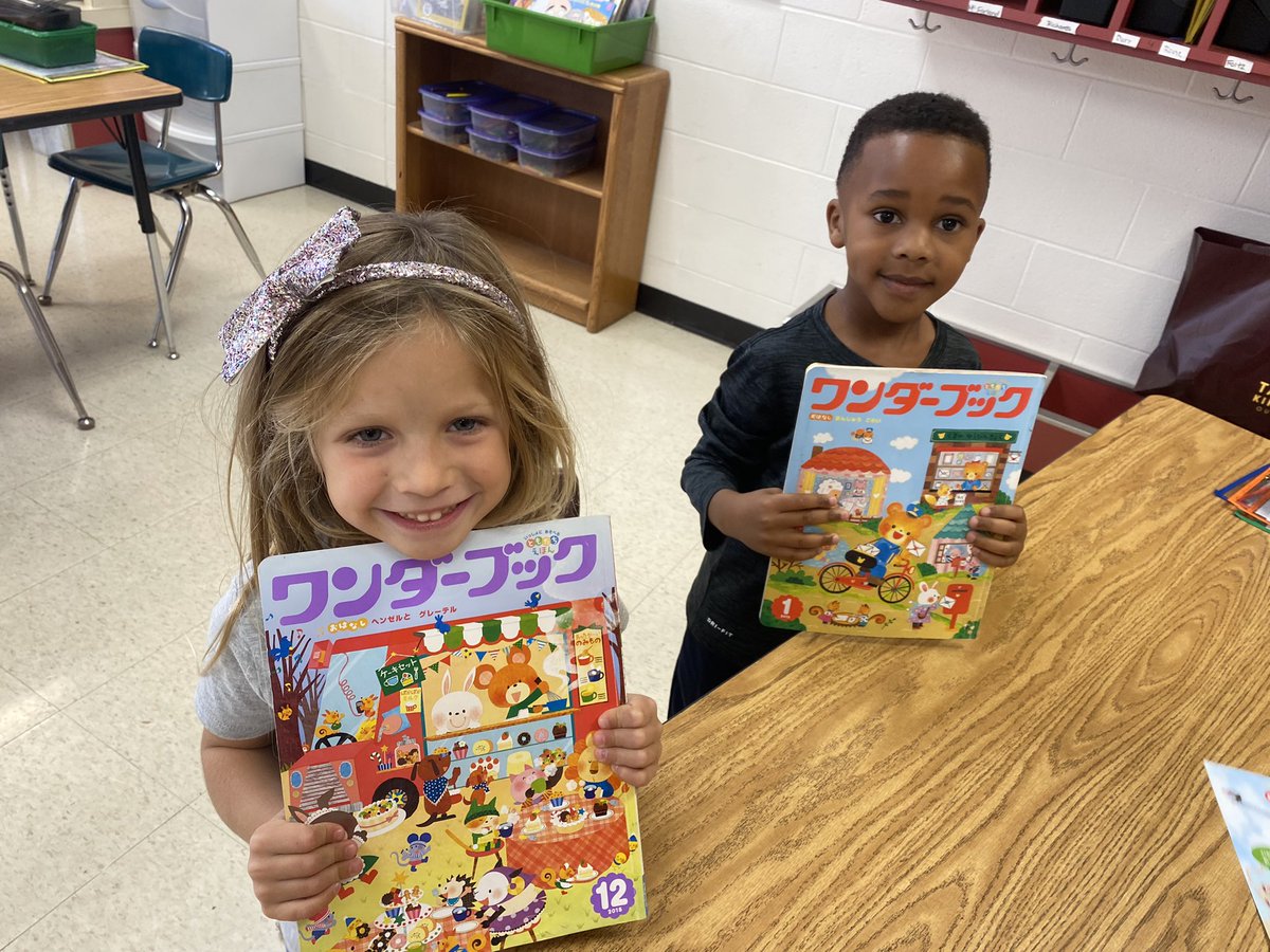 frysensei's tweet photo. Kinders get to explore some Japanese books! Isn’t it cool how Japanese writing can go from top to bottom or from side to side? Even on the same page?! And the books open backwards from ours! 🤩 @richardskclass @EES_Mustangs https://t.co/ytwwlARlkX