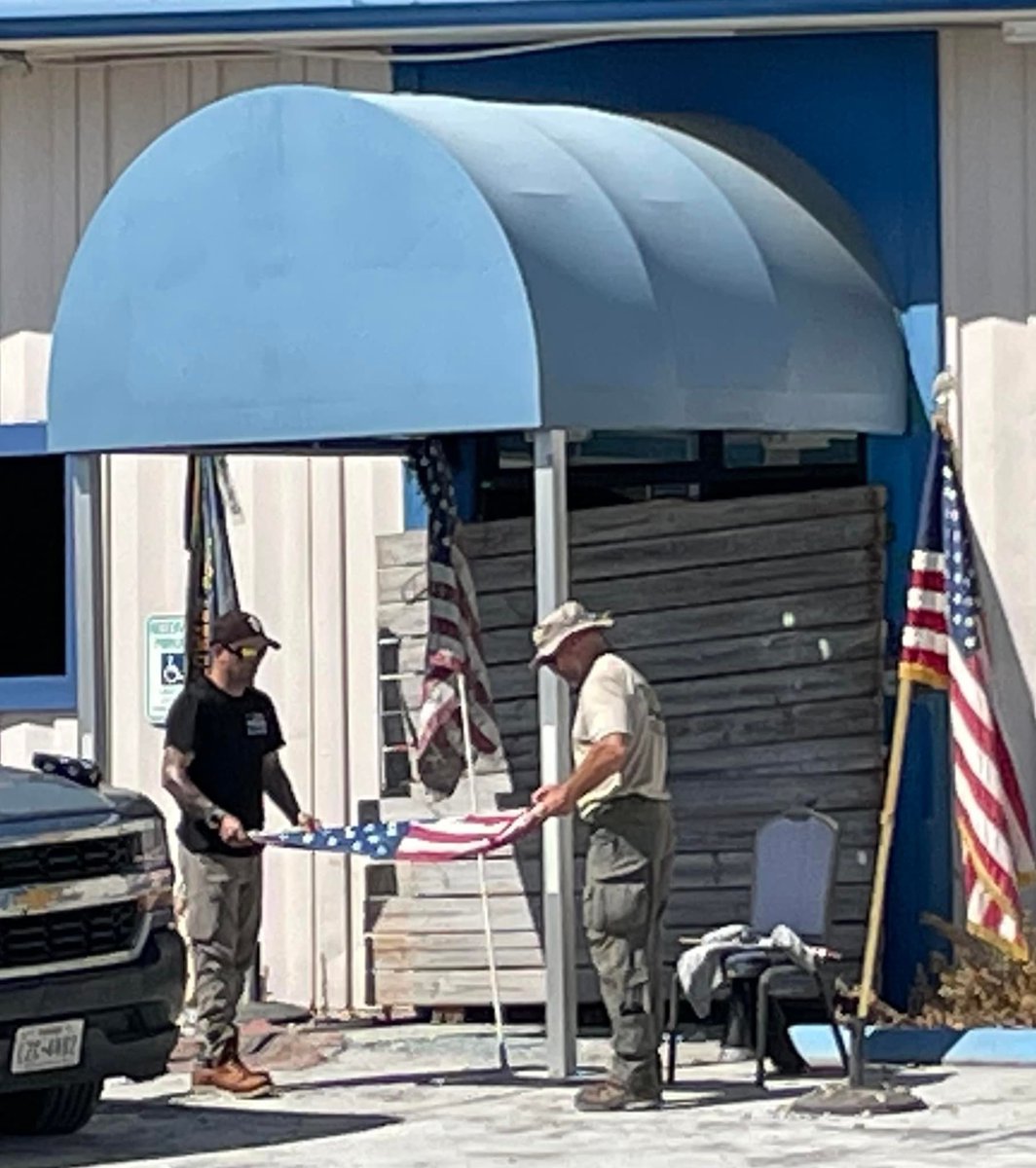 IN_Task_Force_1's tweet photo. The team and our force protection officers have been collecting damaged American Flags along the way to properly handle them in accordance with U.S. Flag code etiquette so they can be respectfully retired. The team also raised a new flag at the American Legion in Ft Myers Beach https://t.co/p1MG7AnBDQ