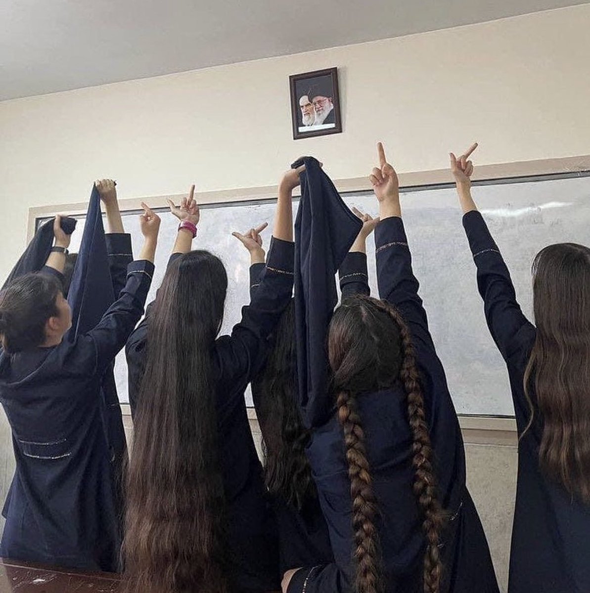 This photo of Iranian schoolgirls removing their compulsory hijab and giving Ayatollah Khamenei and Ayatollah Khomeini the middle finger is iconic.

More than two weeks later, students across the country are standing up to the regime, and the people still courageously fighting.