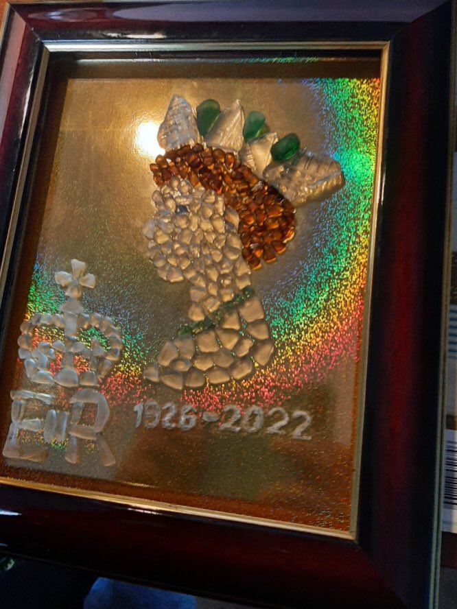 Jayde41's tweet photo. On the nearly one month anniversary of Queen Elizabeth ll death. I sat down to commemorate her in glass. All aspects of this piece are done in Lake Ontario beach glass. What do you think? Have I done her Majesty justice? https://t.co/E5KoCjNcDJ