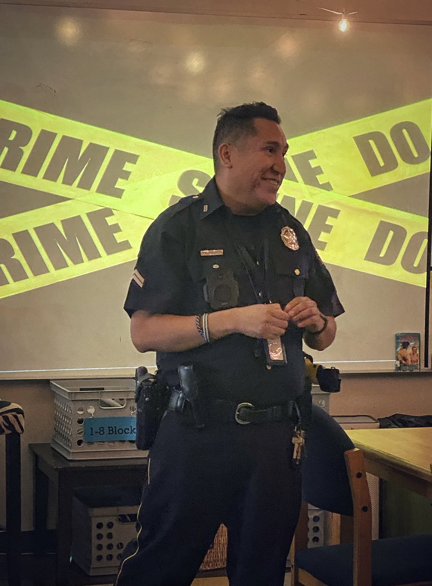 BartholomewRLA's tweet photo. So grateful for our awesome SRO! Officer Alonzo joined us for an investigation into how authors build suspense. Great insight into solving mysteries and looking at the evidence (the text evidence!) 🔎🔎🔎 @WestwoodJH_RISD #RISDBelieves https://t.co/NlMWK8qSYa