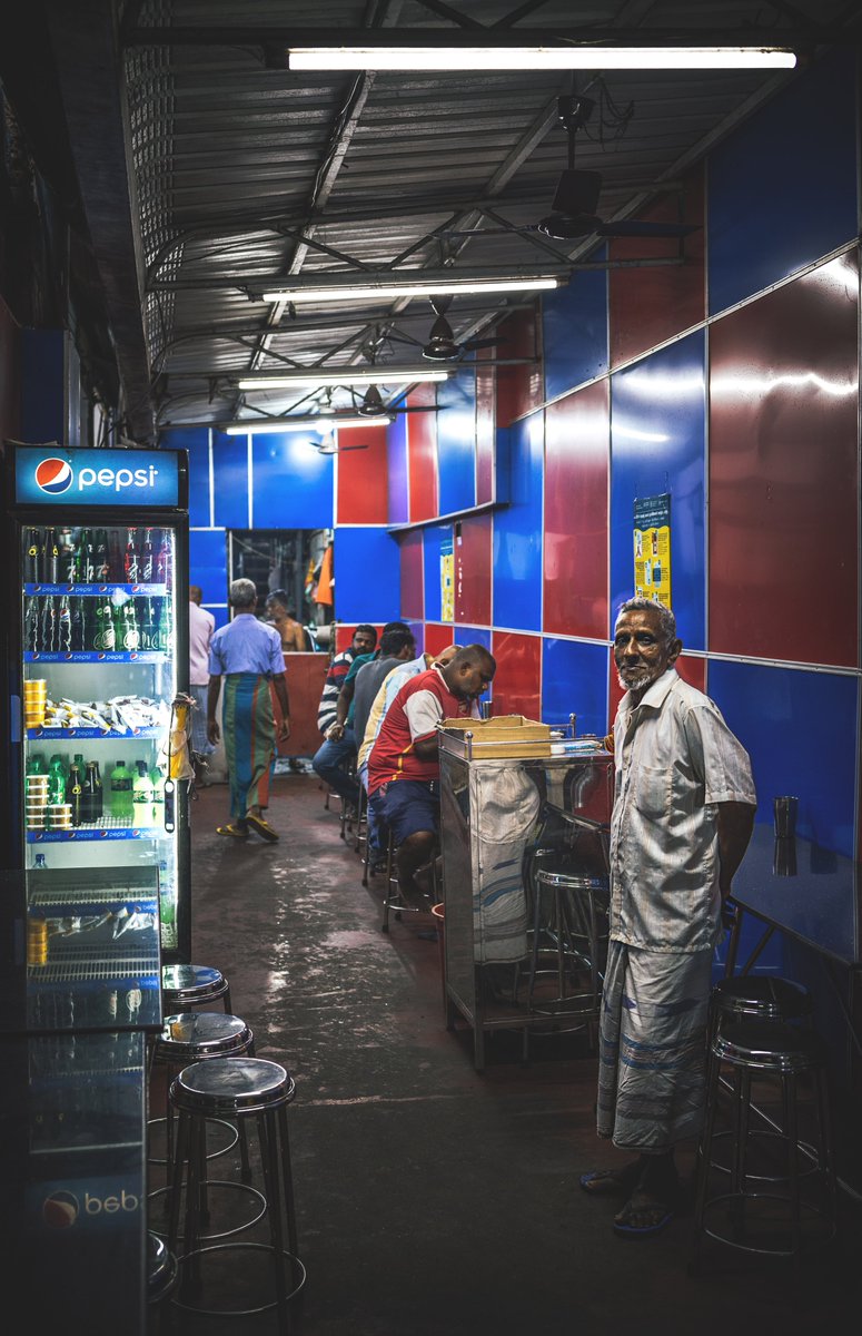 S_MorningLight's tweet photo. BREAKFAST IN #PETTAH
An early diner waits for his #rotti & tea on #KeyzerStreet. But at the end of the alley, #breakfast service is already in full swing. Sep 2022.
More@ https://t.co/DfNwrLS3tJ
#Canon #R6 & #RF35_1_8 courtesy @Canon_SL.
#streetphotography #CanonSriLanka #colombo https://t.co/fZX3gPoEVT