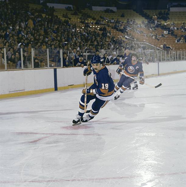 hockey_samurai's tweet photo. Bryan Trottier, Clark Gillies and the New York Islanders are in town but there are a lot of empty seats. Any guesses on what arena this is? https://t.co/xQwovl9pjS