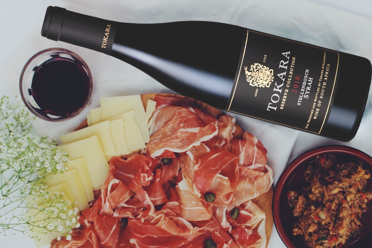 TokaraWine's tweet photo. #WineWednesday: Every sip of Tokara Reserve Collection Syrah 2018 bursts with rich, dark fruit flavours that are deftly underpinned by notes of dried herbs. The silky texture and spicy tannins linger for an eternity. Shop > https://t.co/O7vhT14SfD https://t.co/MJZWpNIhEN