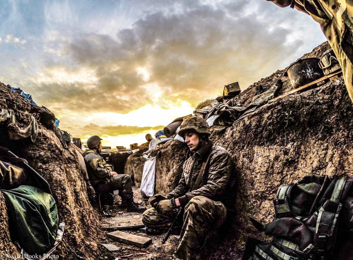 fortleaks21's tweet image. A young soldier sits in the trenches of eastern Ukraine at sunset, his parents thought he was away at college.