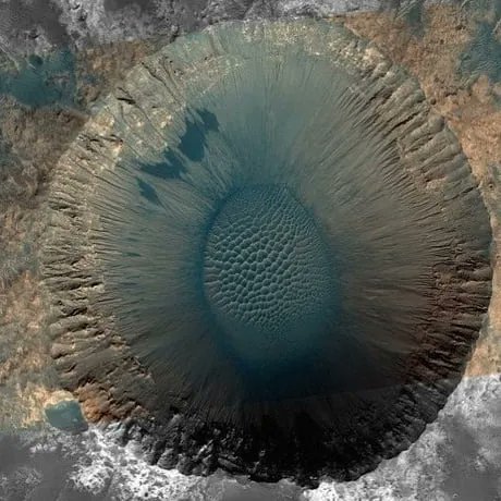 The 1.5 km wide Meridiani Planum Crater. The crater is located on the Meridiani Planum plain, 2 degrees south of the Mars equator. Credit: NASA