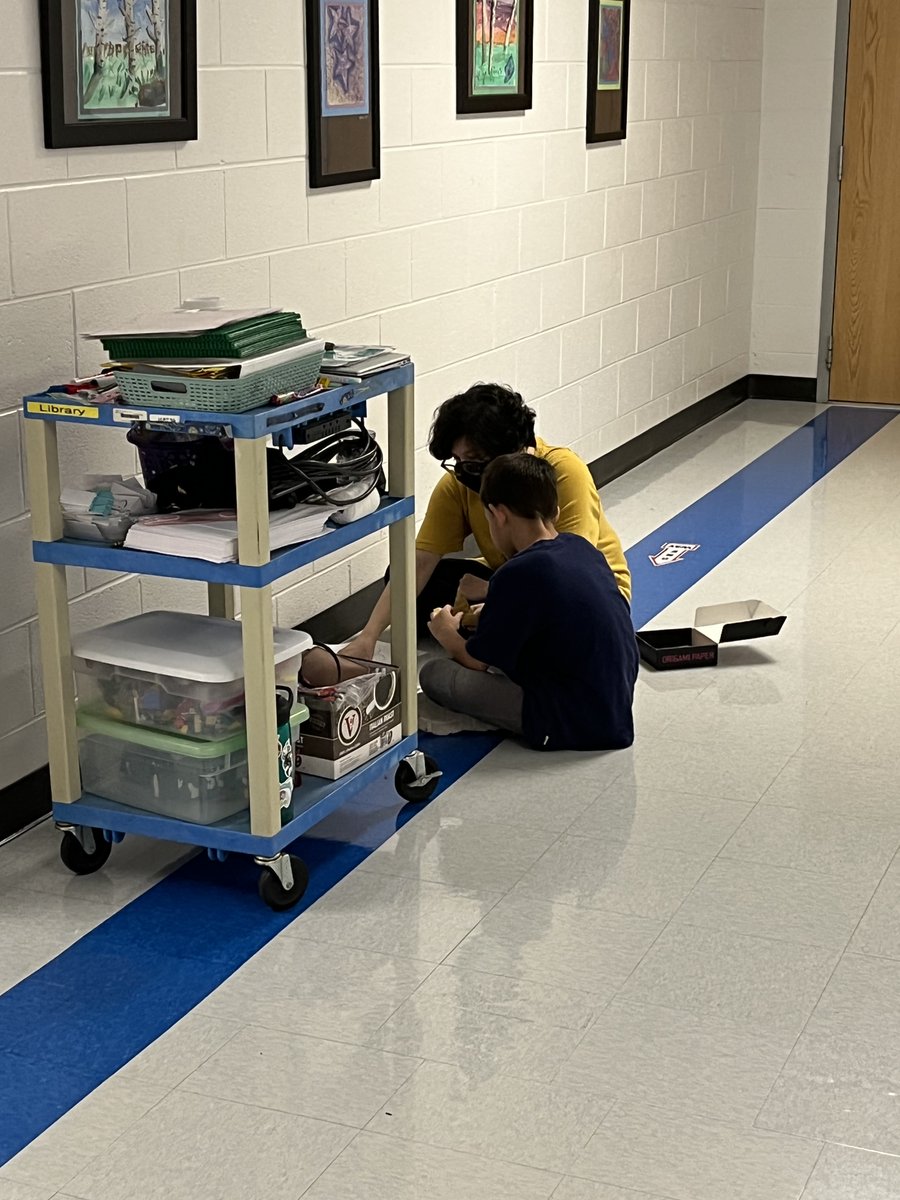 HamptonOaksElem's tweet photo. Spotted! One of our 4th grade students helping Ms. Chau pick out STEM lessons for our younger students. #StrongerTogether #GameOn2022 https://t.co/kOngzplZqI