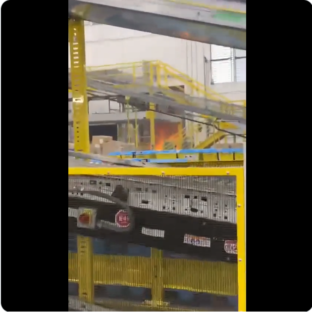 amazonlabor's tweet photo. Amazon claimed the fire was outside the building, videos show that is clearly INSIDE, workers scream to evacuate. Smoke filled the building, workers complained of irritated throats and burning eyes, one worker went to the ER after working their shift. https://t.co/BG0AJfKEV5