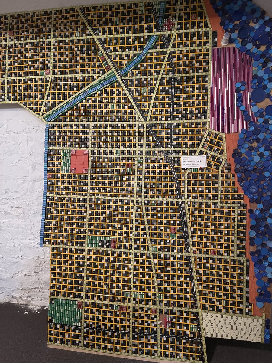 An Evanston map upcycled from keyboard keys, dominoes and more, at the Evanston History Center basement archives. Turns out our neighbor made this. He had to hack off the protruding back nub of each keyboard key to make this.