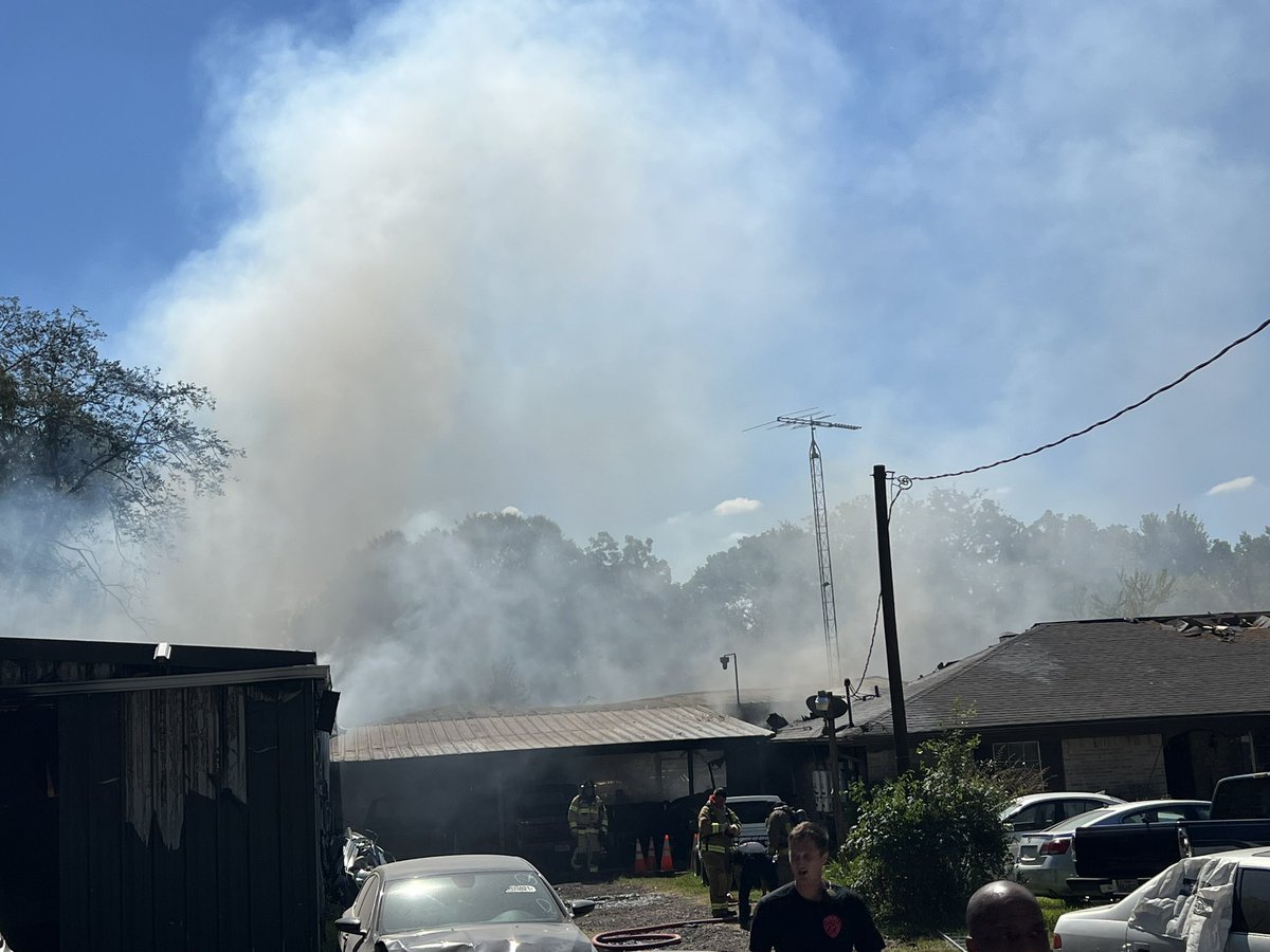 Springfdtx's tweet photo. Spring, Aldine, Eastex and Ponderosa Firefighters are working a multiple alarm fire at a house and attached auto shop on Hirschfield road. Several cars and multiple buildings were burning when the first fire crews arrived. #hounews #twoalarmfire https://t.co/n8Me0MksQc