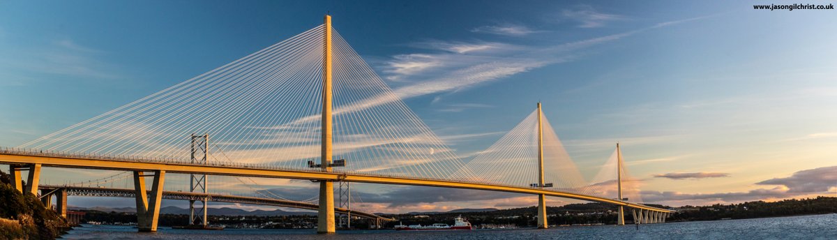 Queensferry Crossing, catching sunset, Fife, Scotland, 02/10. Centre = Moon(rise) & ship: Ramelia. Panorama: click to 👀. #sunset #moon #StormHour #ThePhotoHour #PanoPhotos #panorama #landscape #FirthofForth #QueensferryCrossing #NorthQueensferry #Fife #Scotland #ScotlandIsNow