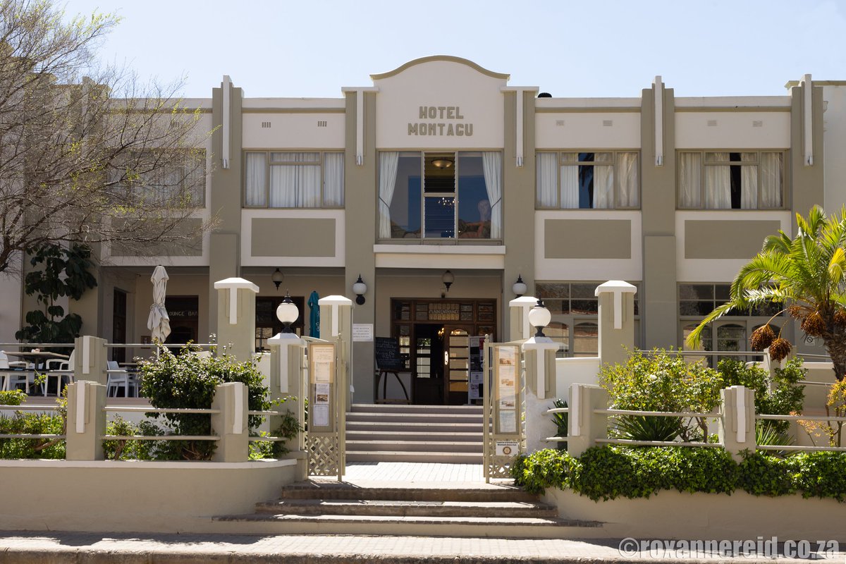 The muted facade of <a href="/MontaguCountryH/">MontaguCountryHotel</a> doesn't foretell the explosion of colour in the gardens behind, the exuberance of the Art Deco wallpaper, paintings and furniture. Built in the early 1930s, it's the only Art Deco hotel in the country. #montagucountryhotel #capecountryroutes