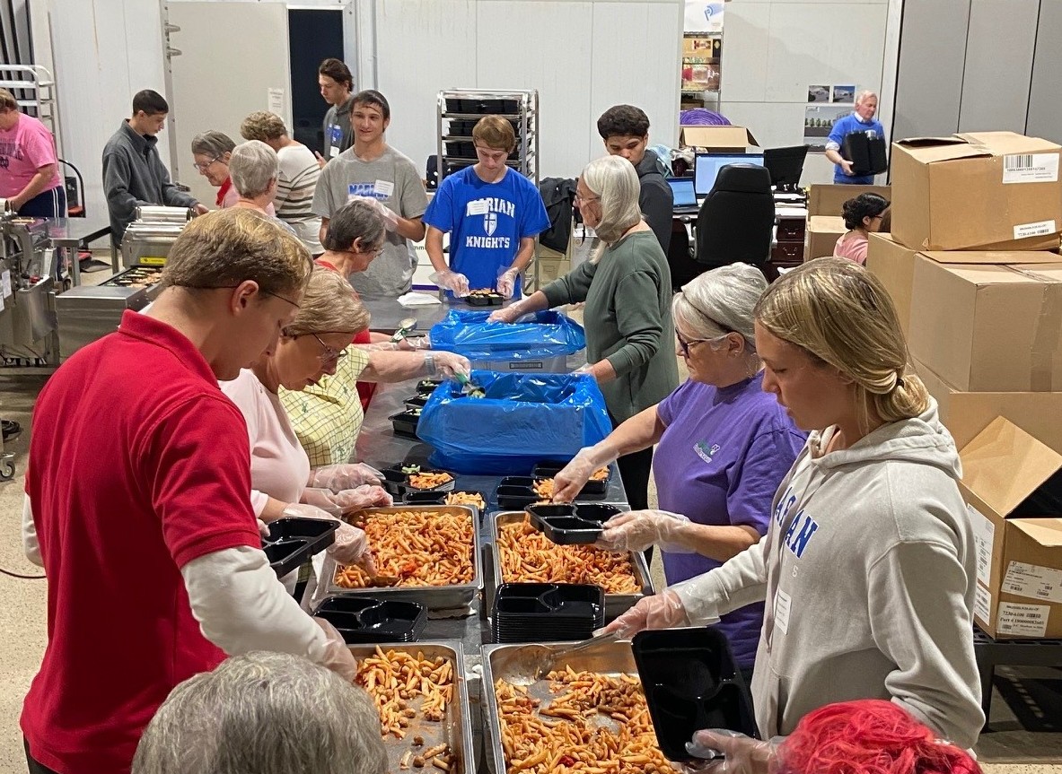 CultivateRescue's tweet photo. @MarianHSKnights sent 29 students and three staff members. They labeled thousands of meal containers and packaged 1445 meals for hungry students in our community! Thank you for your generosity and servant ❤️s! https://t.co/2use6vfX7Q