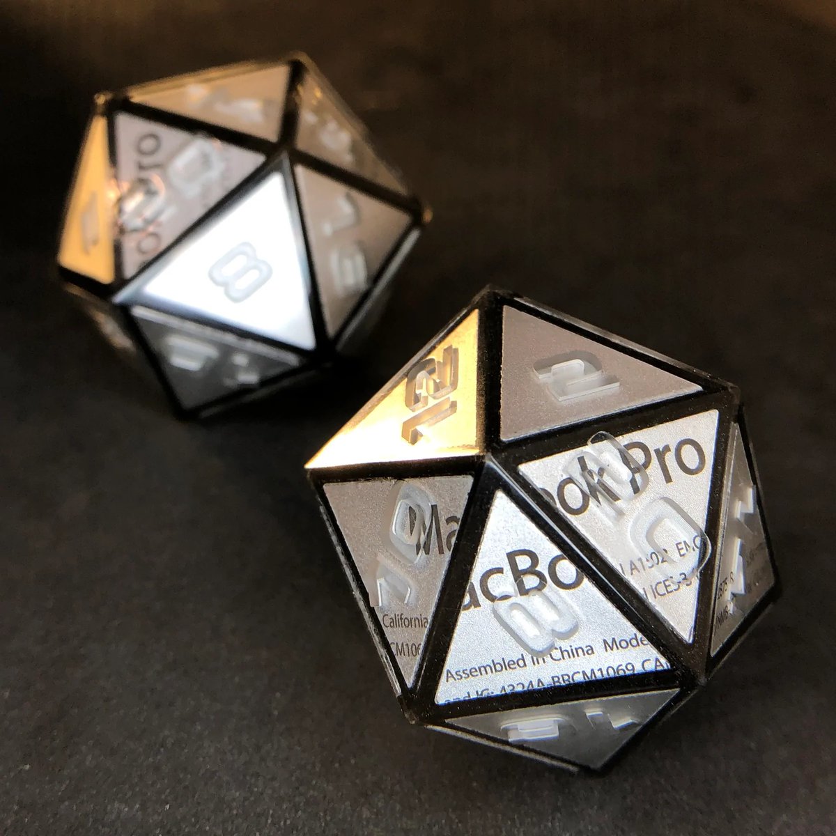 AetherObjects's tweet photo. Behold, the OK Pro! A D20 made from an upcycled MacBook 💻🎲

#handmadedice #5e #polyhedraldice #ttrpg #aetherobjects #pathfinder #dnd #dnd5e #diceporn #shadowrun #dicegoblin #cyberpunk #scifi #ewaste #upcycle https://t.co/GzpGa5iF0T
