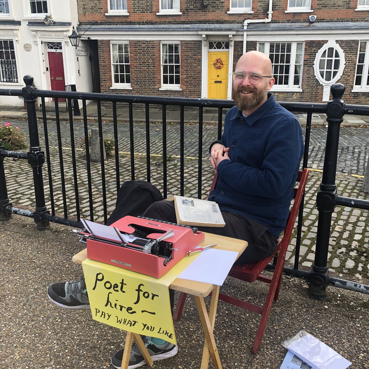 PoetrySociety's tweet photo. It’s #NationalPoetryDay - if you’re down by the Thames in London look out for the regular sight of Luke Davis plying his poet-for-hire trade near The Globe. @Ray_Cappuccino - snapped today by Poetry Society Director @WasThatThunder en route to the launch of @poetrybyheart https://t.co/3v1MSVScgu