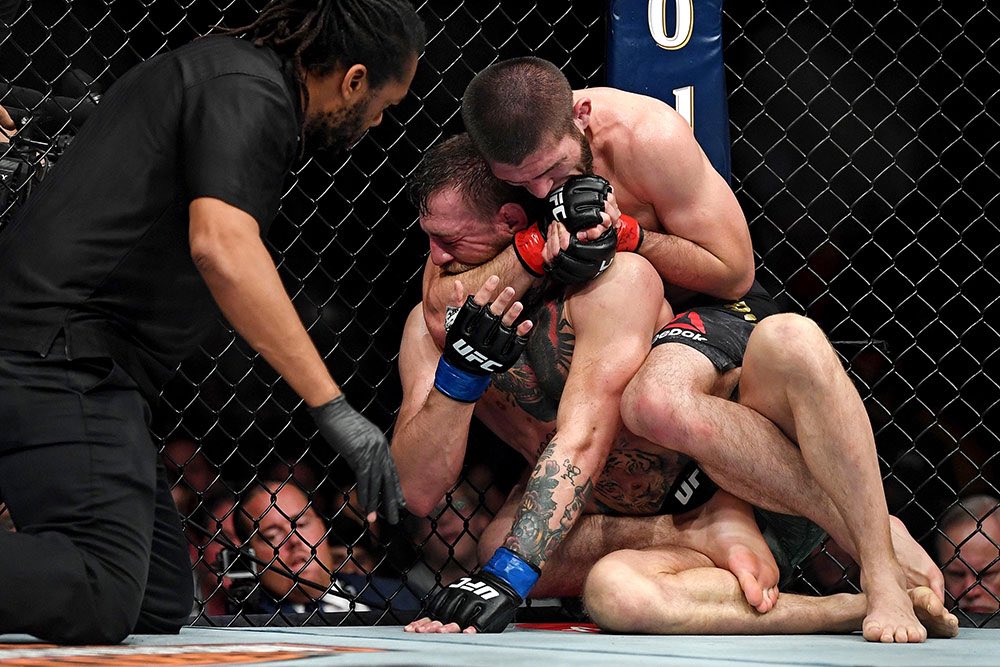 MMAJunkie's tweet photo. 4️⃣ years ago today, Khabib Nurmagomedov finished Conor McGregor in the #UFC229 main event. Then he jumped over the cage, and all hell broke loose. https://t.co/I7no45UDCe