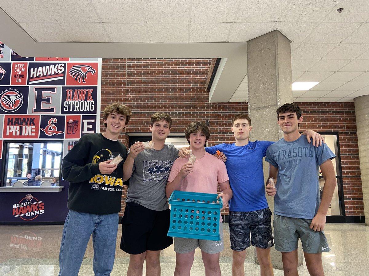 OE sophomores spreading kindness one free donut stick at a time. #justcuz. THIS IS WHAT IT MEANS TO BE A HAWK!!  ⁦<a href="/OlatheEastHawks/">Olathe East High School</a>⁩