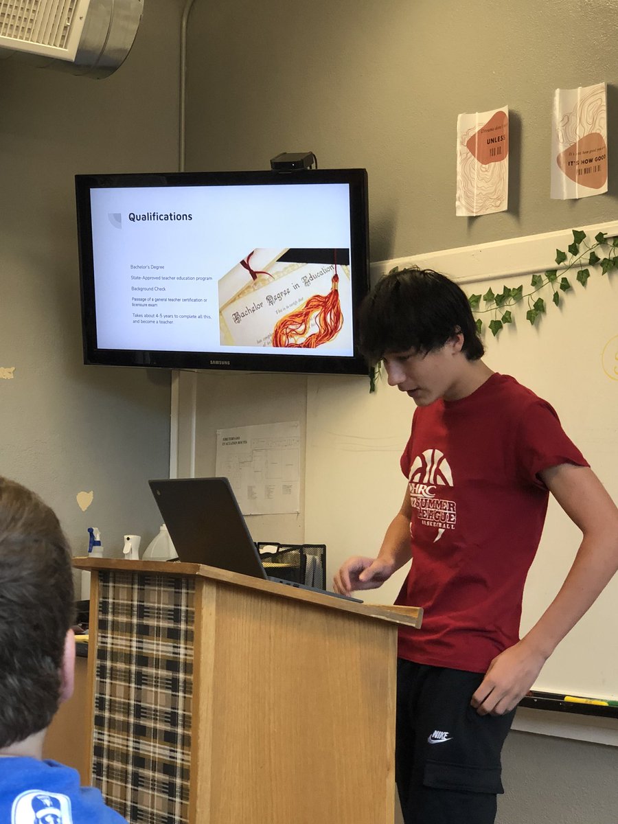 QHS student Gunner Catura presenting in Mrs. Beals English class about the importance of teachers in society.