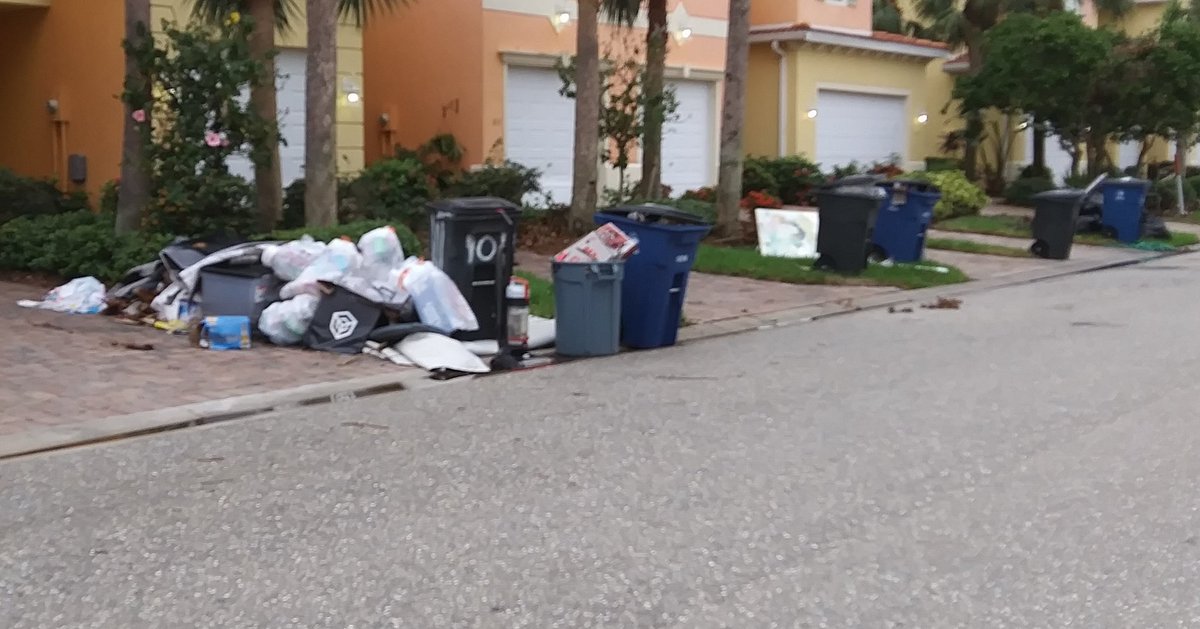 LauraLadybug4's tweet photo. My neighborhood. Debris on sidewalks. Mud & bark in the street. Furniture, carpeting, appliances, baseboards & walls. #ianrecovery #ian #florida https://t.co/V7Mzko0wh3