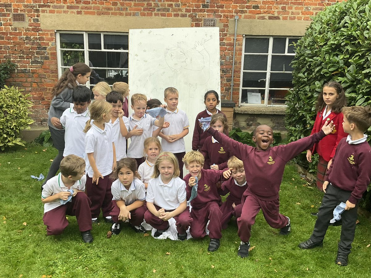 Year 2 having serious fun. Their experiments show soap and water were the best way to wash hands, and sneezing into their sleeves stop the spread of diseases. Poor whiteboard ‘person’ got spattered (in house colours) despite all the handkerchief protection. <a href="/WestbrookHaySch/">Westbrook Hay School</a>