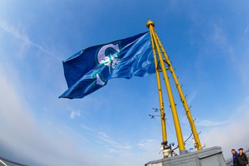 Mariners flag flying at the top of the Space Needle. 