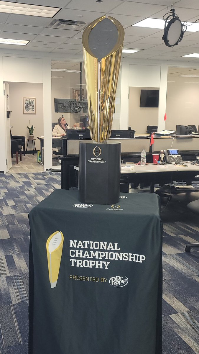 Adam_Orduna's tweet photo. The college football National Championship Trophy stopped by the station today on the way to Lawrence for @CollegeGameDay 

@CFBPlayoff @drpepper 

#TrophyStatus 🏆🏈🔥 https://t.co/IvhgUMZmPe