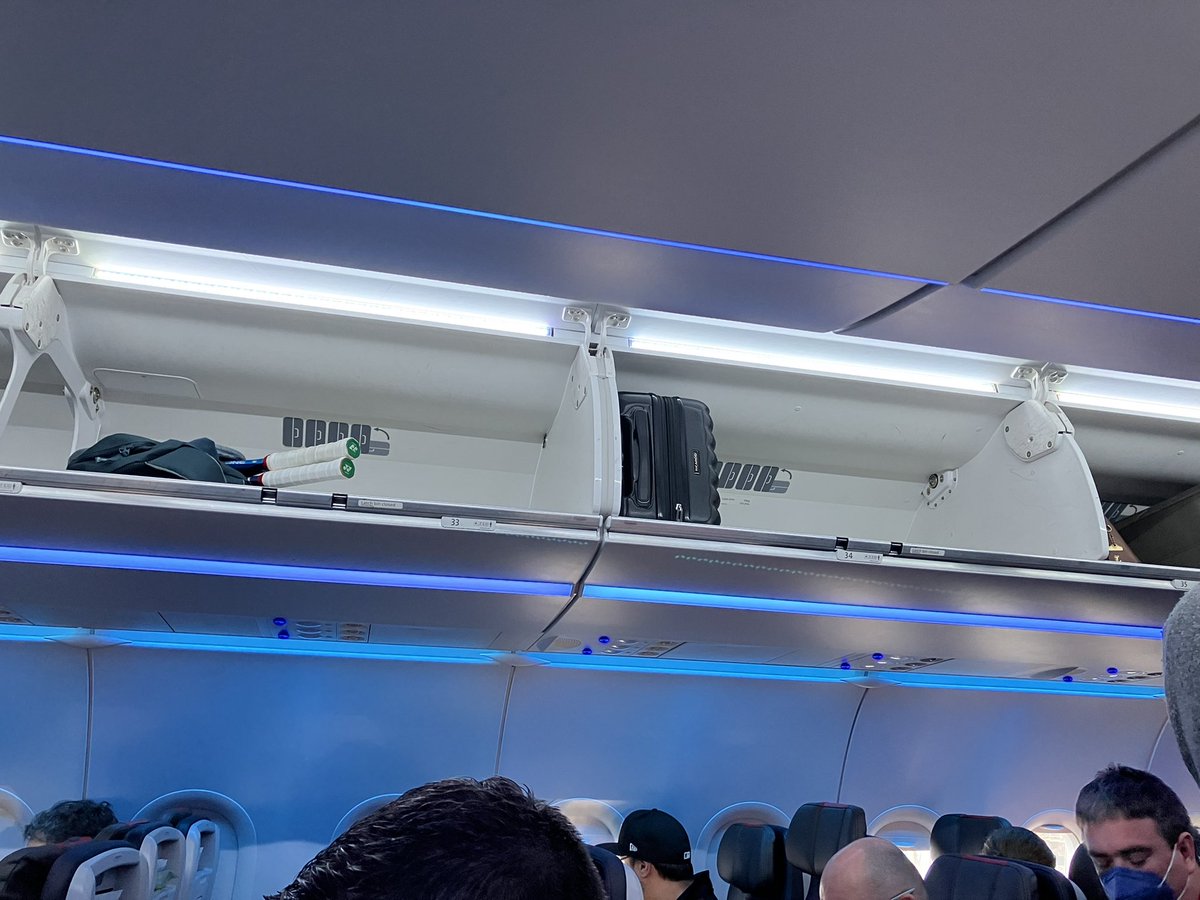 sparklynnrose's tweet photo. @AmericanAir just forced me and everyone (3 full boarding groups) behind me to check our carryons. This is what the bins look like in the entire rear half of the plane. They’re now touting “expanded bin space” on the PA. Haven’t flown AA in years… won’t again. 👎🏻👎🏻 https://t.co/xihwra2XKC