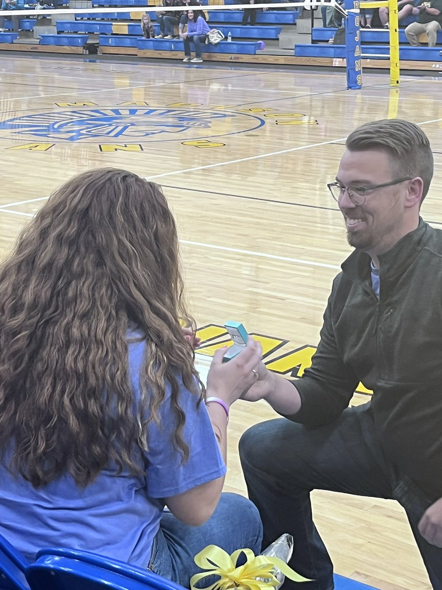 madhsprincipal's tweet photo. And she said, “Yes!!”. Congratulations,  Coach Sitter💙💍💛@Trojans_Madison @maddysitter https://t.co/n0LFo1Waml