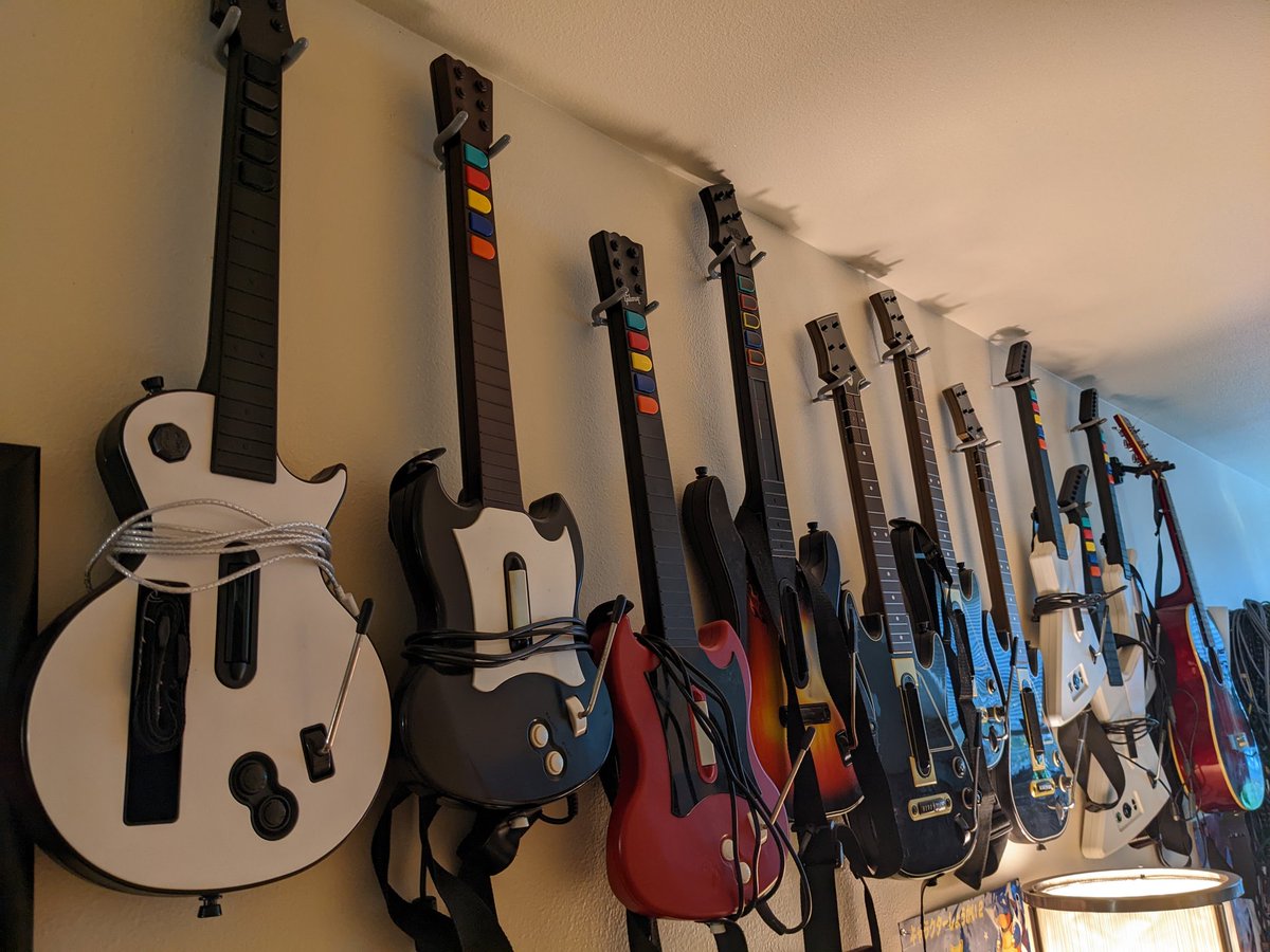 BigTallNotSmall's tweet photo. Did I ever show you guys my Guitar Hero controller collection? 

Big shout-out to @amp_mods for my latest addition on the left. I finally get to try out some mechanical frets on a modded Wii GH guitar. It was a great birthday this year! https://t.co/YMewrRus1i