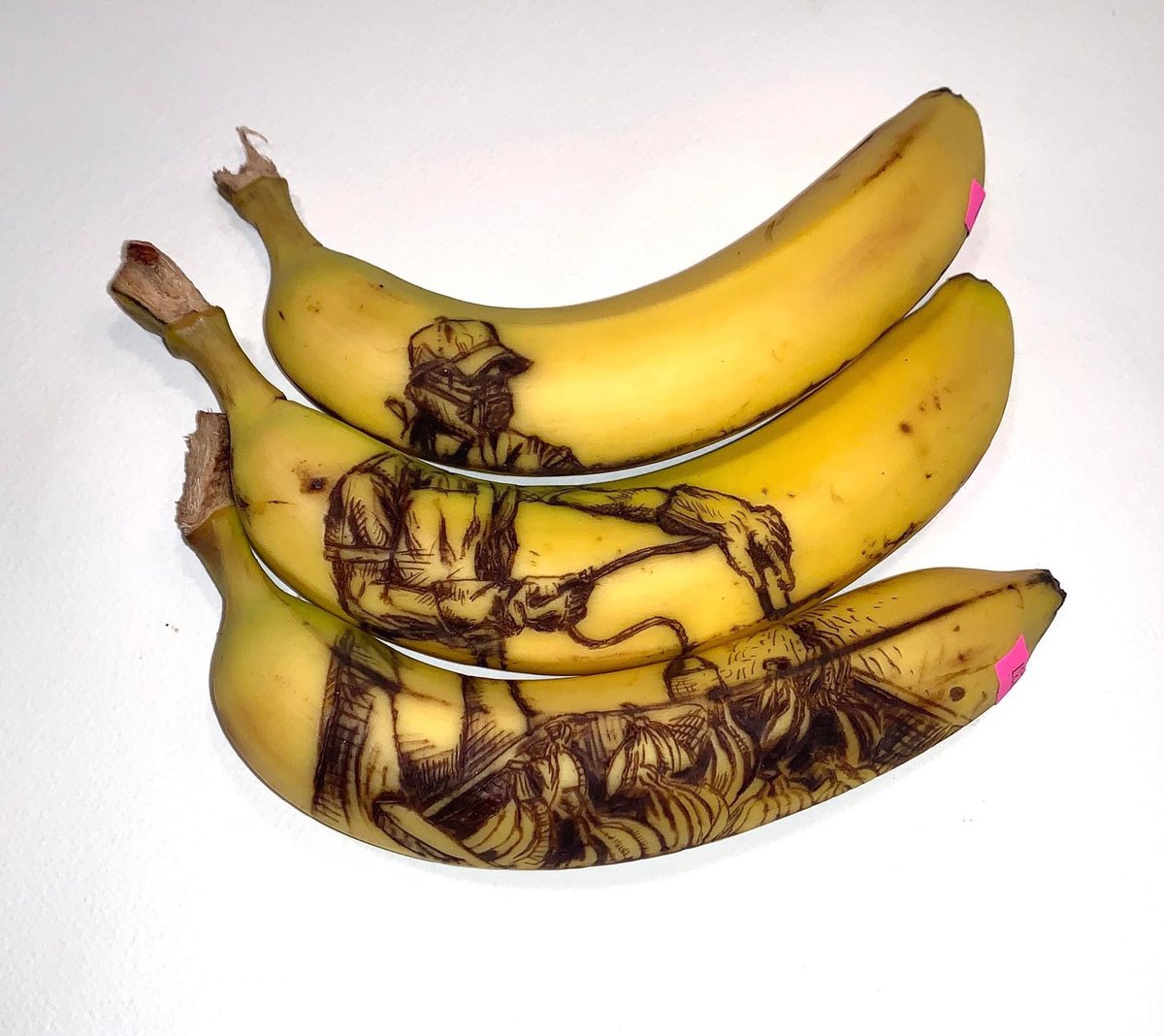 BrynARedding's tweet photo. When my daughter’s art teacher says “no paper drawings allowed” she creates a unique statement by bruising bananas with a toothpick. Since the black takes time to emerge, it means having to draw without visibility. 🤯❤️👏 https://t.co/eKw1Hcbxvh