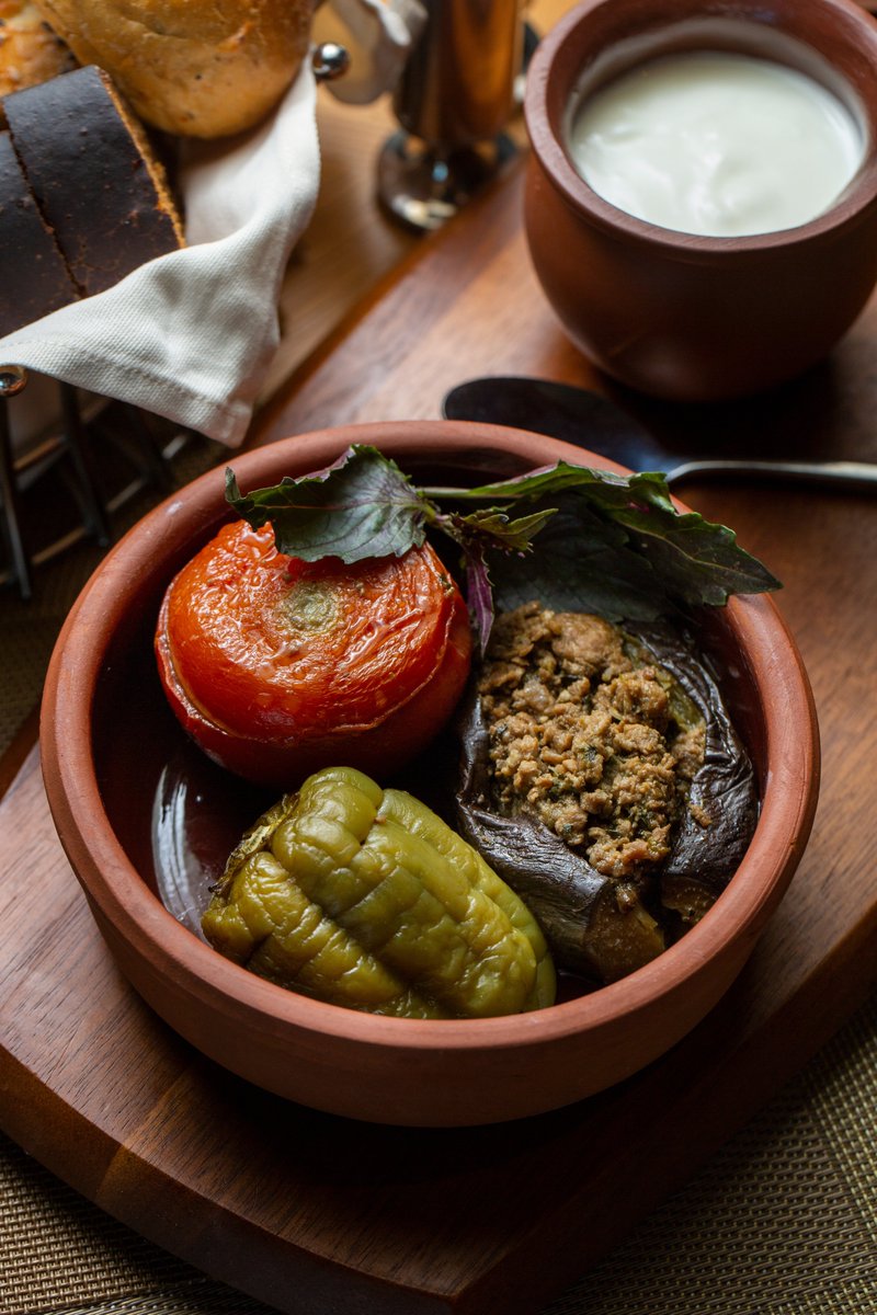 ExperienceAZE's tweet photo. 🍽️“Dolma” is close to the Azerbaijani verb “doldurmaq” (“to stuff”), but what exactly is stuffed and with what varies.  This is the succulent Movsum dolmasi ("Seasonal dolma"), in which aubergines, sweet peppers and tomatoes are stuffed with minced meat.
Hungry❓ https://t.co/nTsMfr4zYQ