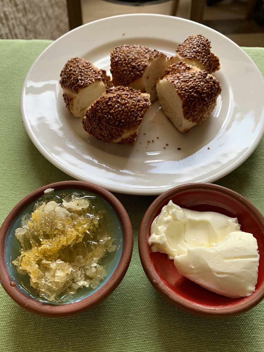 There is no apt way to describe this breakfast! It’s the Turkish bread Simit with clotted cream called Kaymak and honeycomb 🍯. It’s just sublime. <a href="/Deepti_Unni/">St Beernard</a> and I just couldn’t stop eating it. So good! 

#Cappadocia #Turkey #Food #foodphotography #BreakfastClub