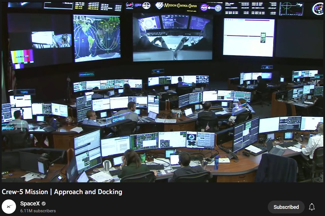 JeffSullivan's tweet photo. you know you work for a IT connectivity company when... you see the @SpaceX control center and your first thought is... I wanna meet their IT guy.  Then @mlclmdnldsn points out the 2 peeps on the bottom left have at least 11 screens, 3 keyboards, 2 laptops. https://t.co/UmtVj46Vqh
