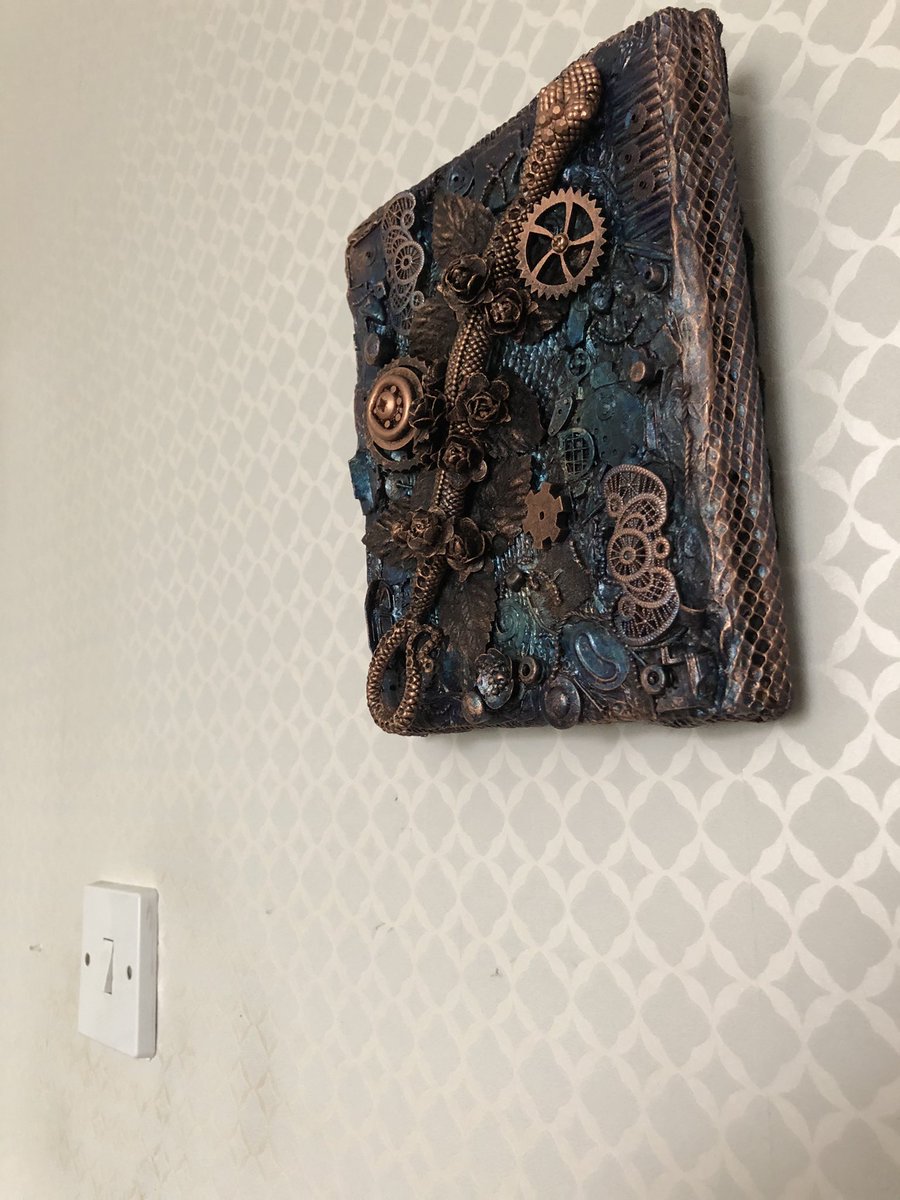 ButtonSteampunk's tweet photo. The Serpent and the Rose - My latest mixed media assemblage addition to my Etsy shop. I haven’t done one of these for a while. #serpent #rose #roses #mixedmedia #mixedmediaart #mixedmediaartist #assemblage #assemblageart #steampunkbutton https://t.co/6Yp9Cm11lV