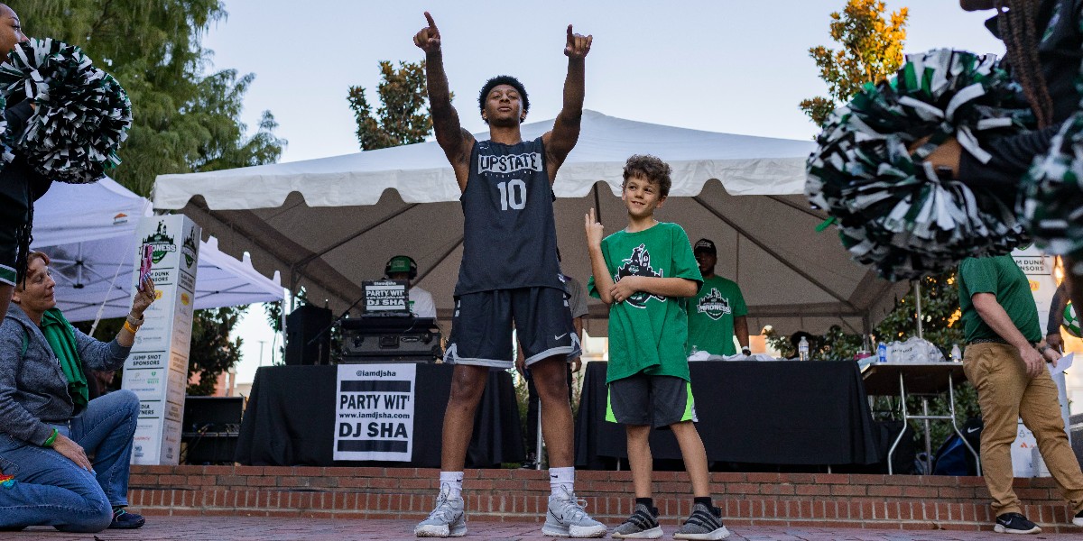 USCUpstate's tweet photo. Thanks to all who helped make #MorganSquareMadness a resounding success! We painted downtown Spartanburg green (not literally) and got our fans amped for the start of our Men's and Women's basketball seasons! More photos: https://t.co/YHxQYgRkgR. #uscupstate #reimagineupstate https://t.co/tEozgyebny
