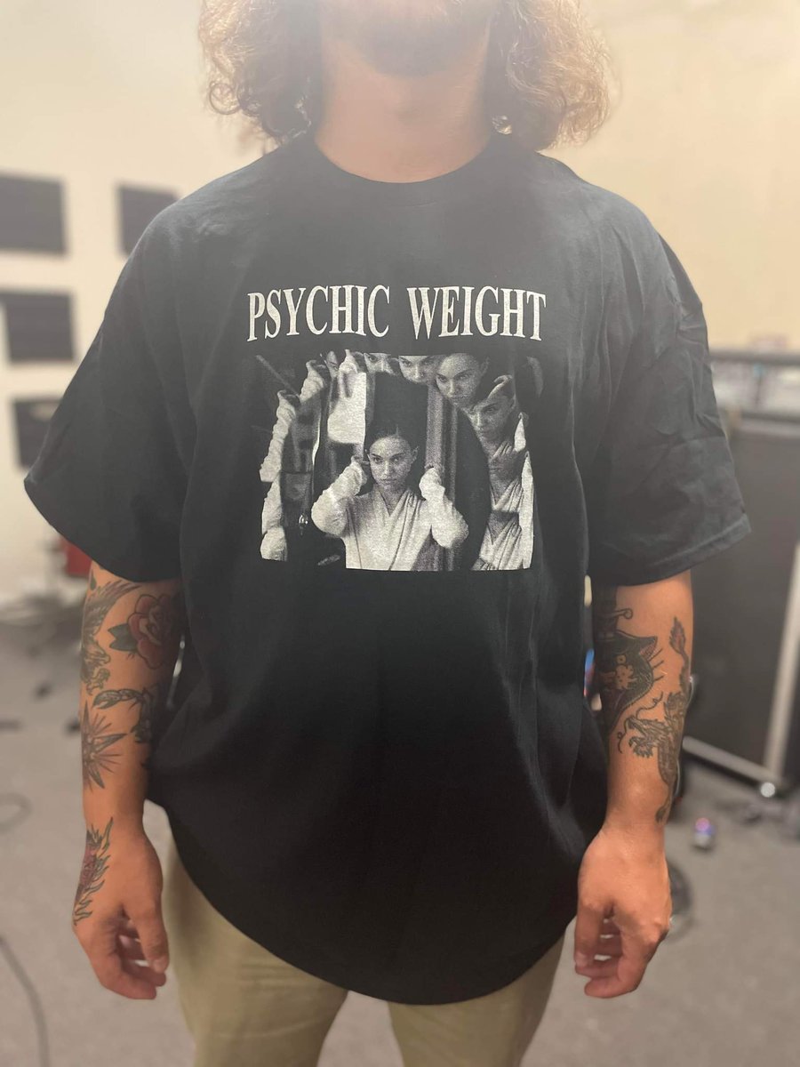 PsychicWeight's tweet photo. You ever want to own a t-shirt with the original Psychic Weight logo? You ever want to own a t-shirt depicting Natalie Portman having a psychotic break while gazing into a vanity mirror? Kill two birds with one stone and then come pick up a shirt at one of our live shows. https://t.co/woIjSxsvQZ
