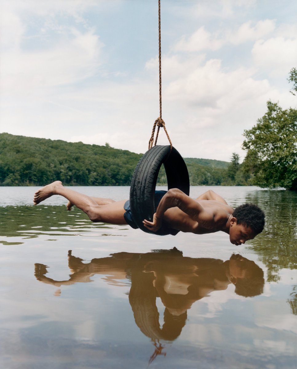 Gagosian's tweet photo. For "Chrysalis," Mitchell (@Tyler_Mitchell_) produced photographs of youthful subjects in nature. Playfully theatrical and surreal, the works focus on Black figures and the landscapes they inhabit, incorporating visual signifiers of spirituality, transformation, and aspiration. https://t.co/92x4ZRhnOh
