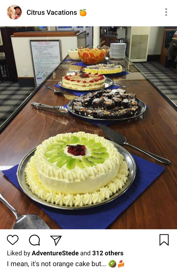 Roach's IG. Image of cakes in the dining hall, and a cake with kiwis on it. Caption reads: I mean, it's no orange cake, but.... Kiwi emoji