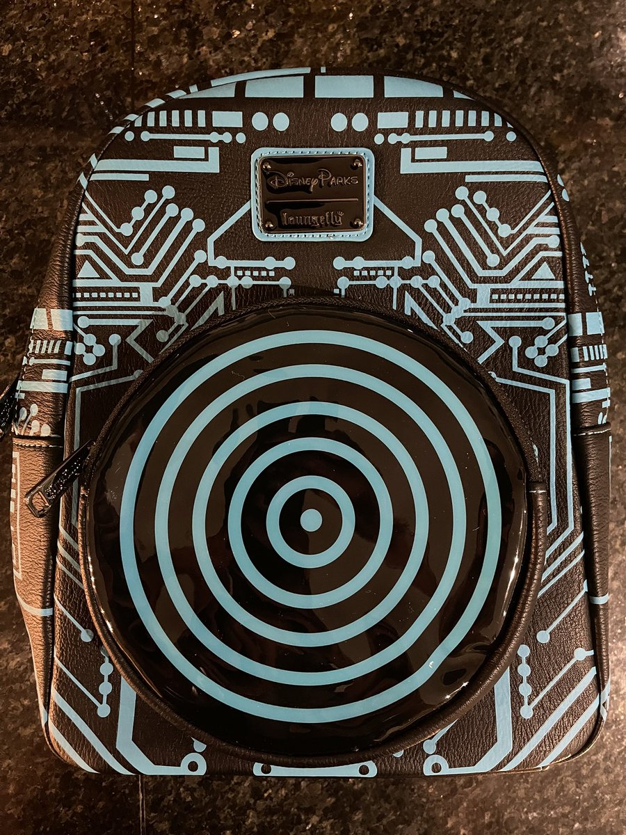 ch4os_theory's tweet photo. Loungefly Tron 40th anniversary mini backpack pictured with the Oakley Tron Legacy backpack from 2010. The ‘data disc’ on the back lights up #tron #tronlegacy #loungefly #myfirstloungefly #Disney #tron40 #oakley https://t.co/vtkevq8L0o