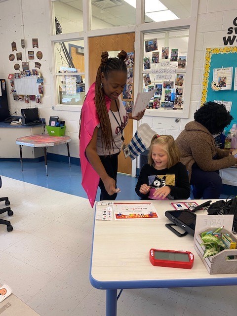 BrooksideBruins's tweet photo. Brookside's very own Super Hero "Attendance Girl" also known as Mrs. Saunders, recognizes Brookside's Attendance H.E.R.O.s (Here Every day Ready &amp; On time). Congrats on making perfect attendance for the first 30 days of school. #ChristinaStrong https://t.co/tUhRShbnOO