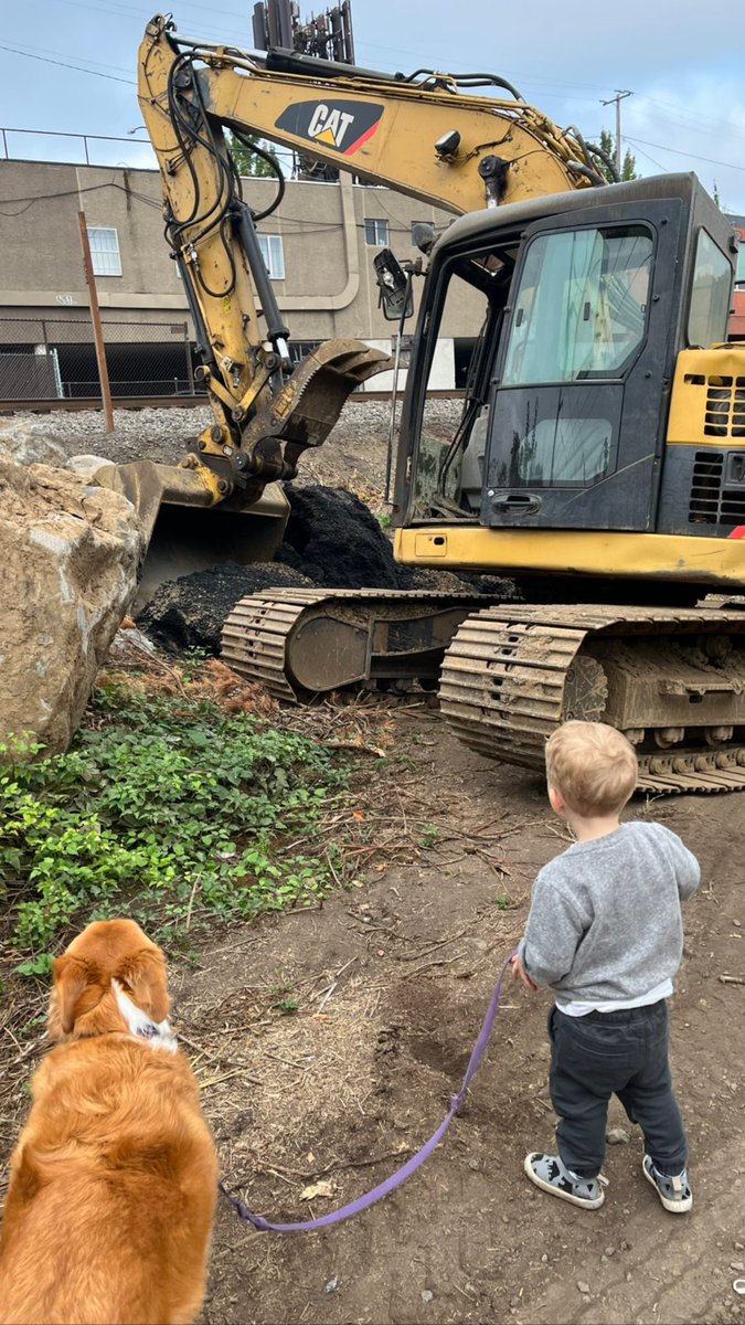 A boy and his loves … dog and dirt.
