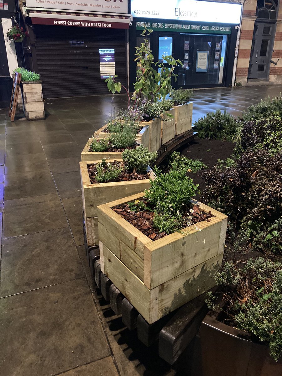 heathy33andabit's tweet photo. Interesting move from someone. Planters placed on the benches around the clock tower. #hanwell https://t.co/cp2Do7c3Bu