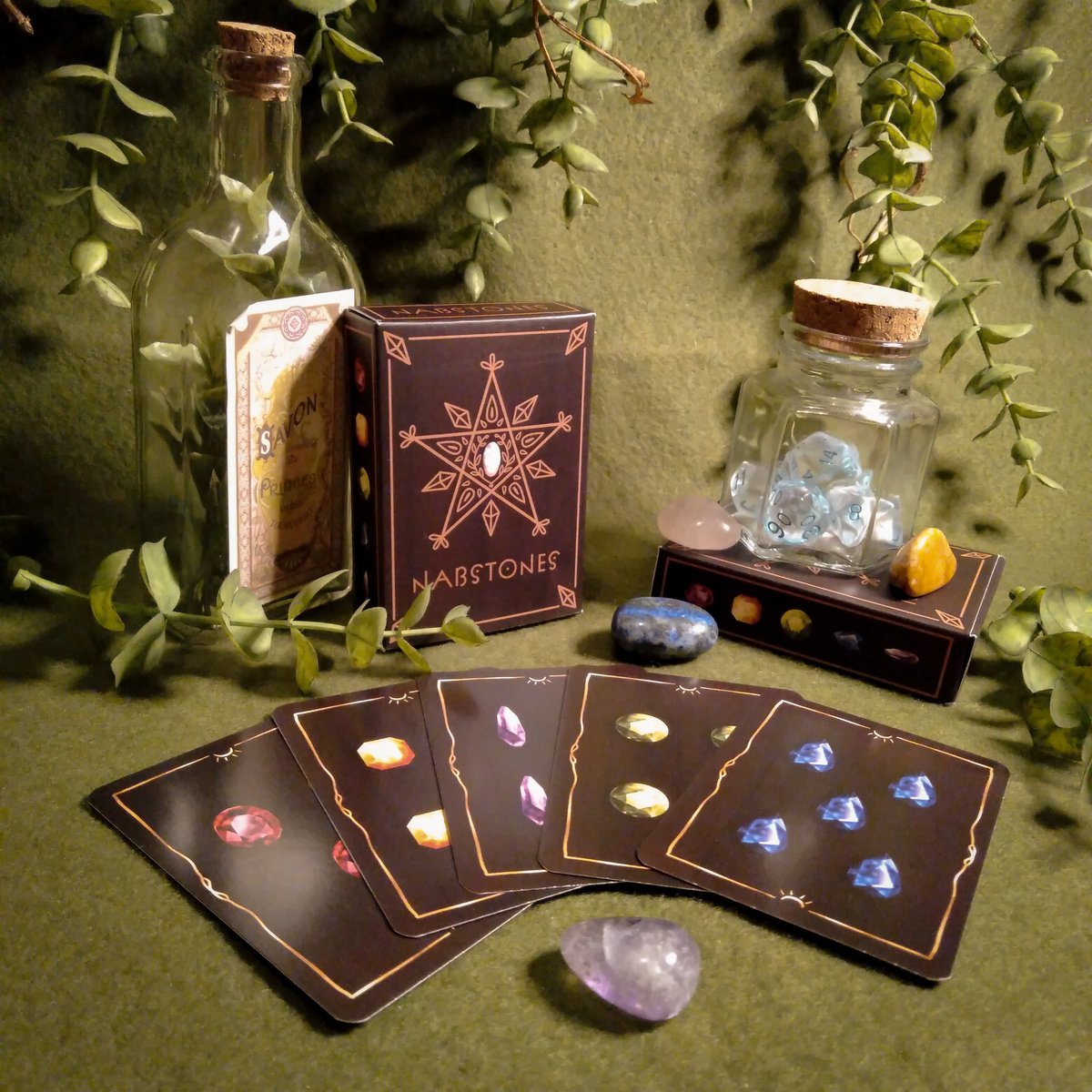 NABSTONES IS AVAILABLE NOW! we are so proud of this little game that we made, and it's now on our shop!  the-murmuring-mystic.square.site

#IndieGameDev #cardgame #boardgame #gamedev