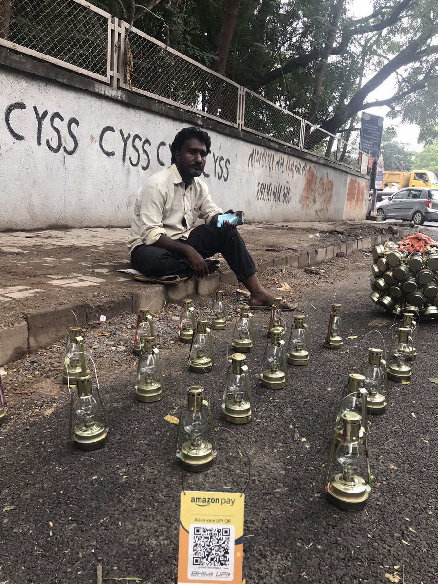 Road to #DigitalIndia Akil Sheikh selling metal lamps for #Diwali2022 on a road in #Ahmedabad. Sheikh, who does business displaying his wares on city roads, says he opted for digital payment for convenience of his customers. <a href="/PMOIndia/">PMO India</a> <a href="/CMOGuj/">CMO Gujarat</a>