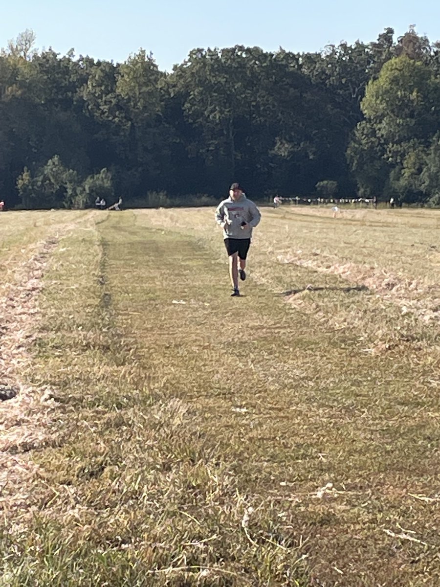 Coach Noga sprints to cheer on his team at Vilonia.