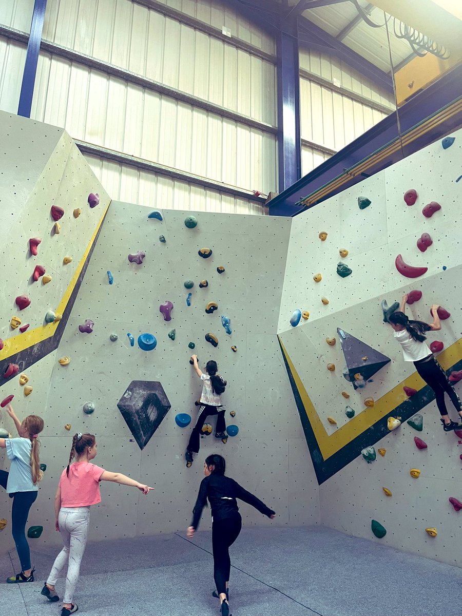 DrMemehattan's tweet photo. It’s Emily’s birthday party today and she’s brought her friends to an indoor climbing centre. There are two other girls who look like exactly like Emily however. 🤣 (Emily is in the centre climbing). #MiniLara 🧗🏻♀️ https://t.co/XppWgGzeNH