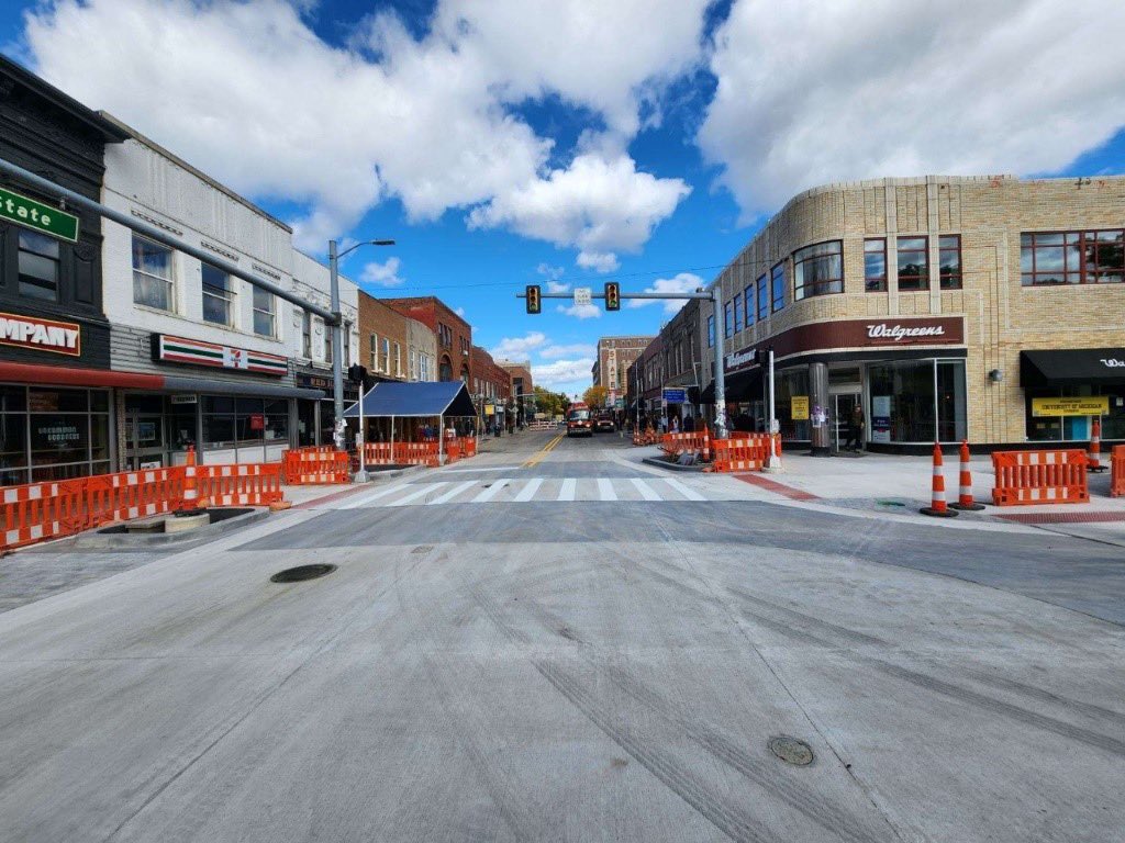 Pavement markings necessary to open the street are complete and barricades are being moved. State St. will reopen momentarily! Head to the District to check out Ann Arbor's first curbless street design and #BuyNearby to support our local businesses! 📸: <a href="/A2DDA/">Ann Arbor DDA</a> #statestdistrict