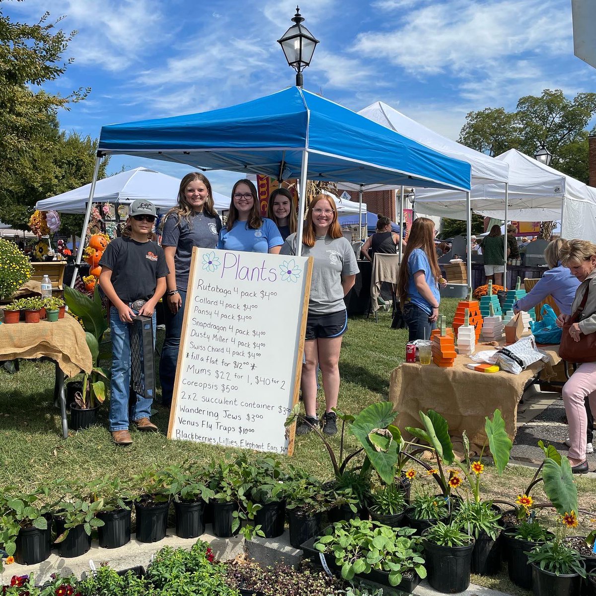 PendletonHigh's tweet photo. Our FFA is hard at work today. Don’t forget to stop by their booth today at the Pendleton Fall Festival accross from The Village Bakery. They are selling raffle tickets, plants, and student made decorations. #seeyouonthegreen #pendletonsc #bestFFA #supportourstudents https://t.co/NiR9fb1CF8