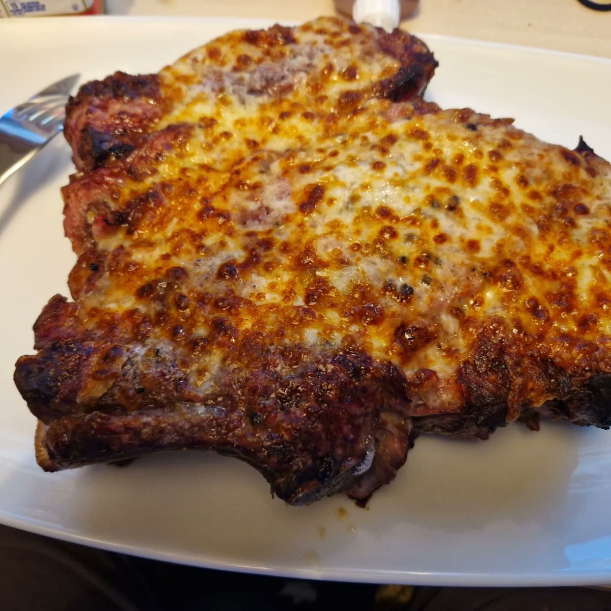 shutawaydad2's tweet photo. Both me and my son watch @beardmeatsfood religiously so he challenged me to eat in his words a "beard" sized steak AKA a rib of beef in 30 mins. I cooked it med/rare just a simple S.P.G seasoning but thought sod it and added cheese. 22mins 51seconds after plating I can't move https://t.co/uOaeMOvWXb