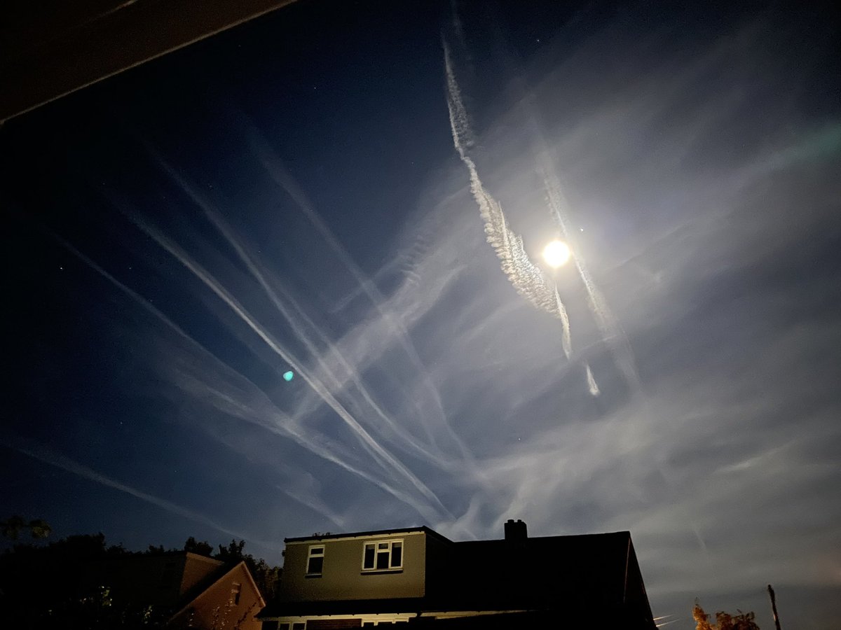 Adams999's tweet photo. Picture taken at midnight on 9/10/22 with the white twist next to the moon (and Jupiter to the right of the moon) and the straight white lines to the left of the moon… anyone know what it is?! #moon #nightsky @itvmeridian @HollyJGreen https://t.co/QFXiDX8b1v